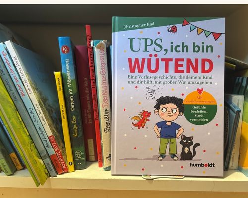 Foto von einem Bücherregal, in dem Mittig das Buch "UPS, ich bin wütend" steht